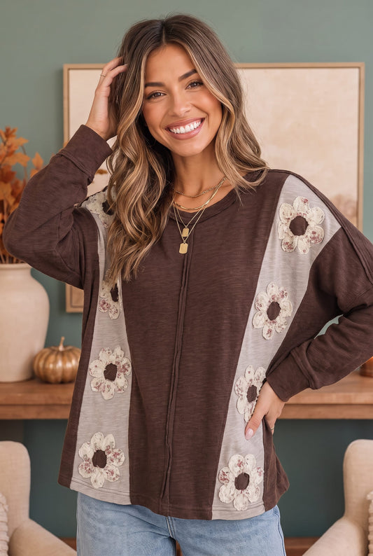 Chocolate brown long sleeve knit top with daisies, photo 1 of 3
