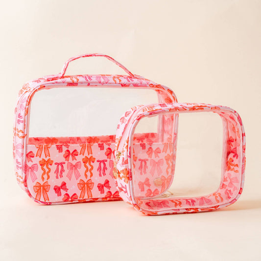 Clear cosmetic bag set with pink bow design, photo 1 of 3